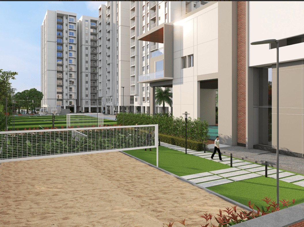 Outdoor sports courts with volleyball/badminton nets and residential towers in daylight
