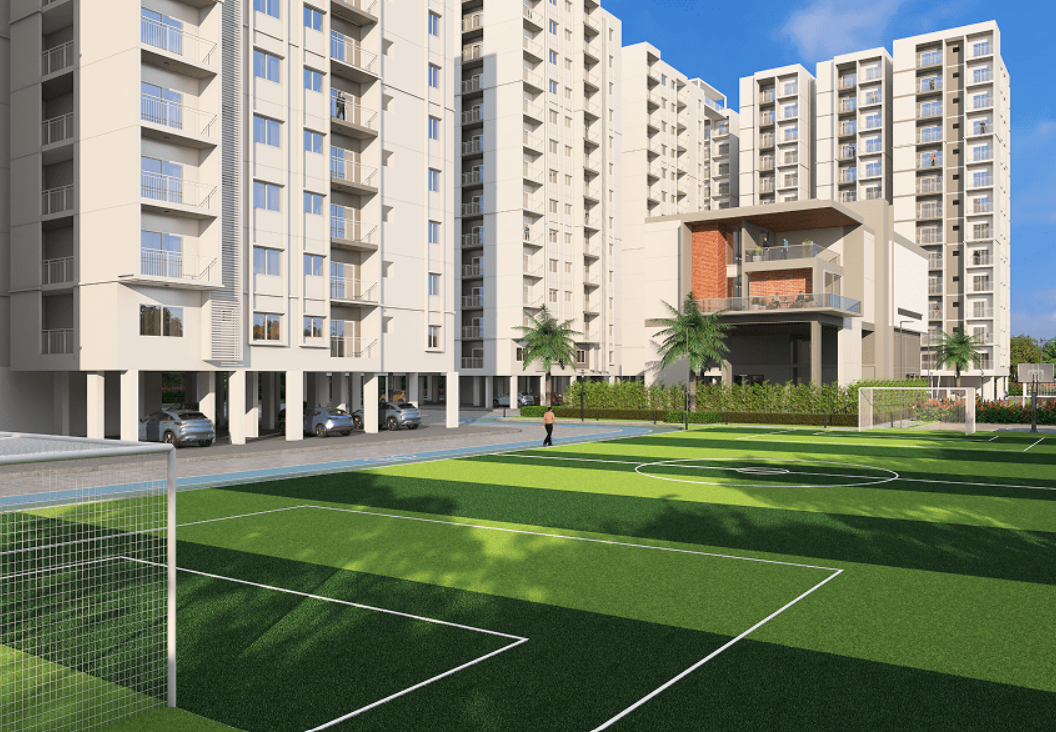 Ground level view of tennis and badminton courts with residential towers under blue sky